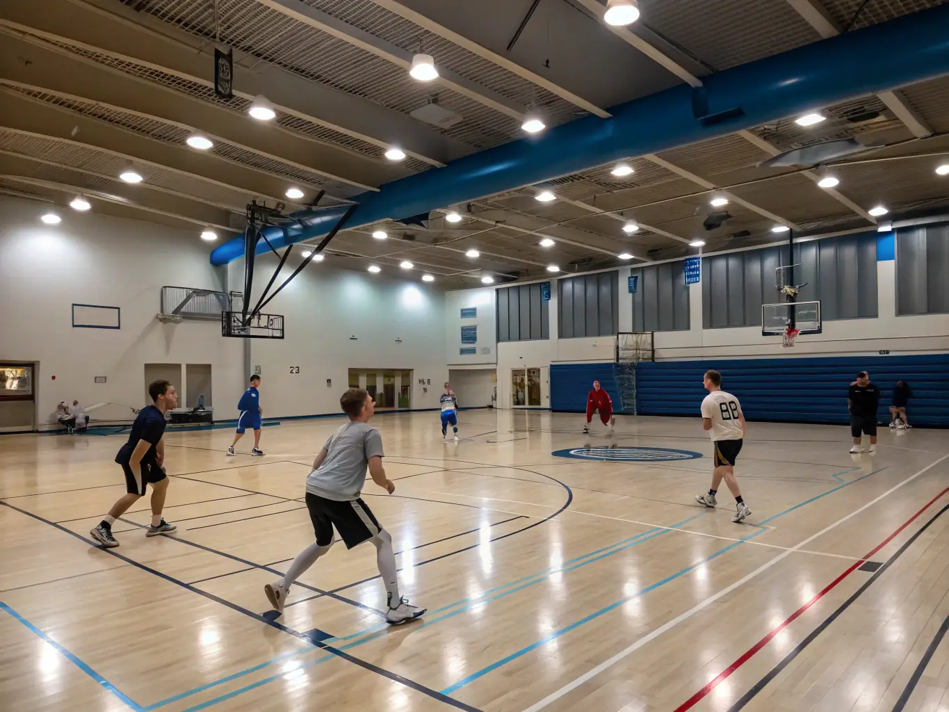 A diverse team of students from ASS SPORTIVE COLLEGE ENSEIGNEMENT SECONDAIRE SOYAUX are working together during a basketball practice, emphasizing collaboration and strategic thinking.