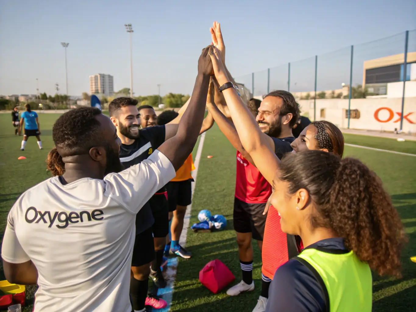 A diverse group of young athletes celebrating a victory, showcasing the spirit of teamwork and achievement in ASS SPORTIVE COLLEGE ENSEIGNEMENT SECONDAIRE SOYAUX.